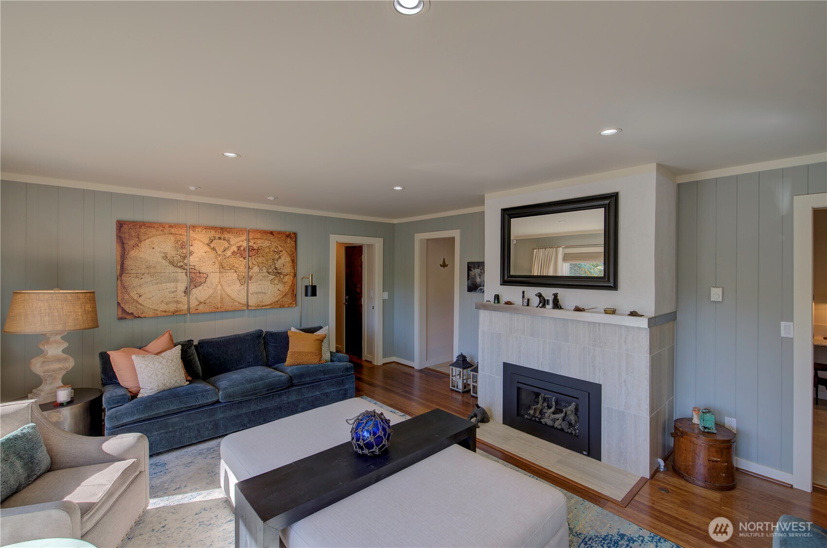 1115 34 Street Seaview, WA 98644 - Photo 13 of 31 a living room with furniture a flat screen tv and a fireplace