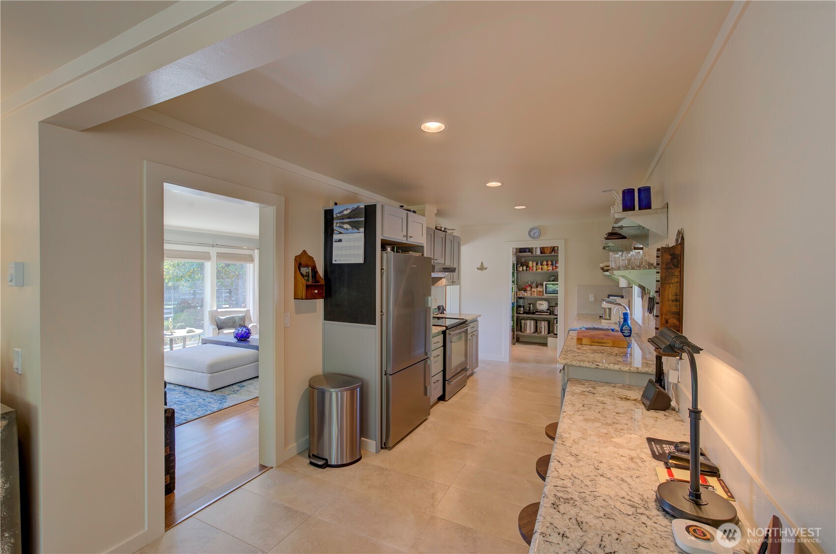 1115 34 Street Seaview, WA 98644 - Photo 15 of 31 a living room with furniture and a flat screen tv