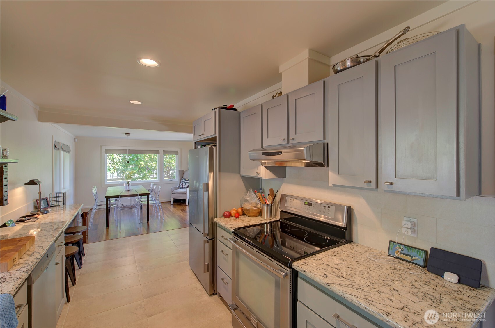 1115 34 Street Seaview, WA 98644 - Photo 17 of 31 a kitchen with a stove a sink and a refrigerator