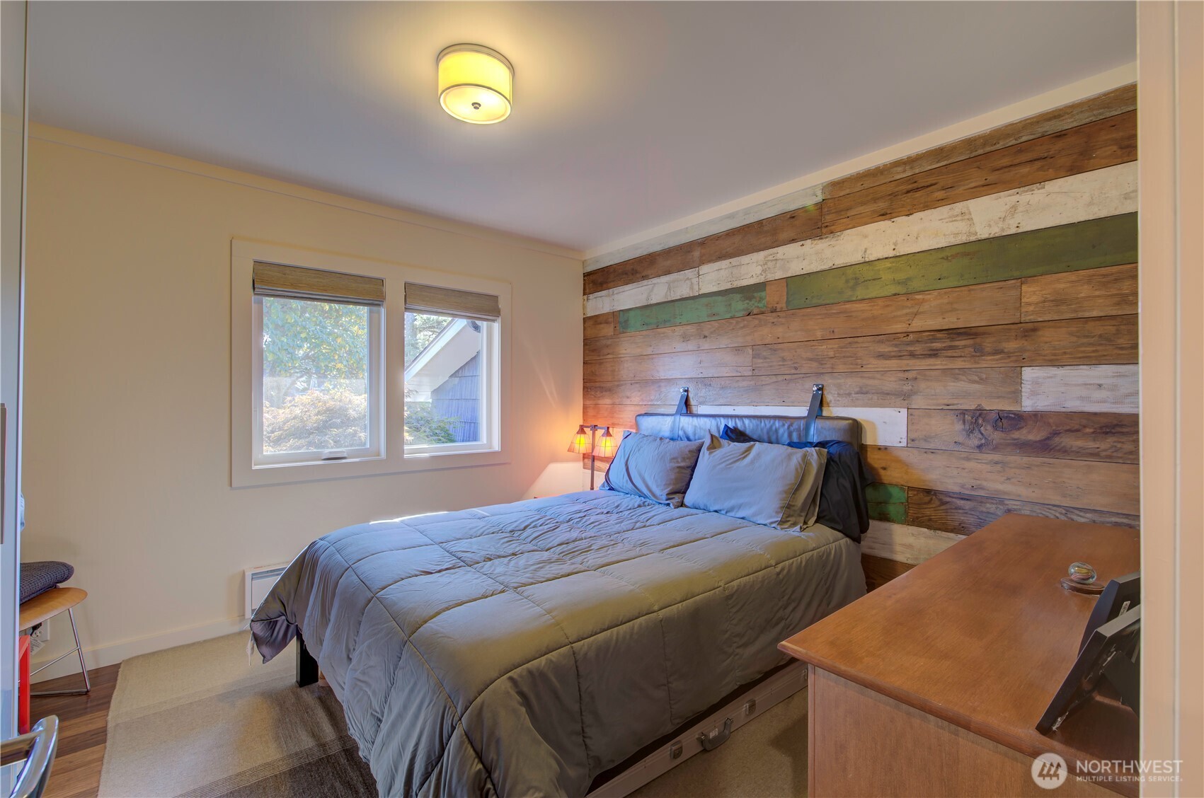 1115 34 Street Seaview, WA 98644 - Photo 18 of 31 a bedroom with a bed and a window