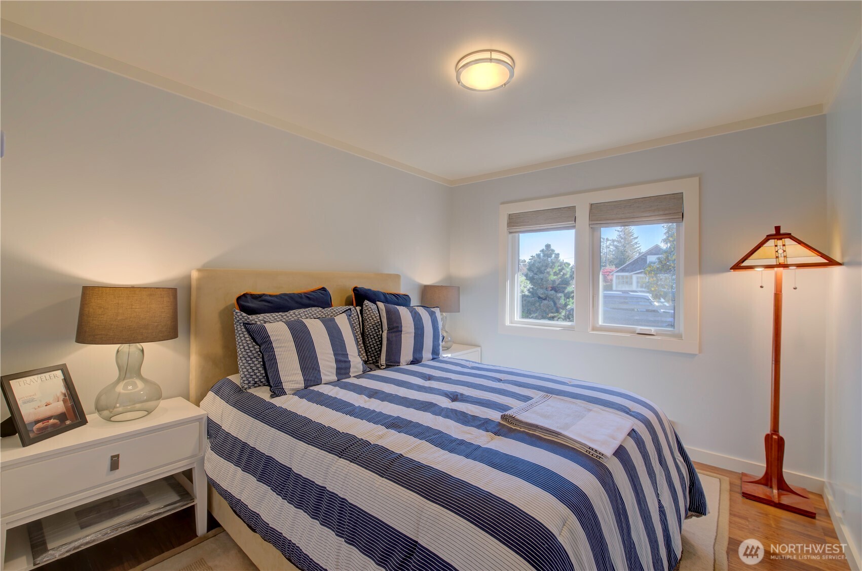 1115 34 Street Seaview, WA 98644 - Photo 19 of 31 a bedroom with a bed and wooden floor