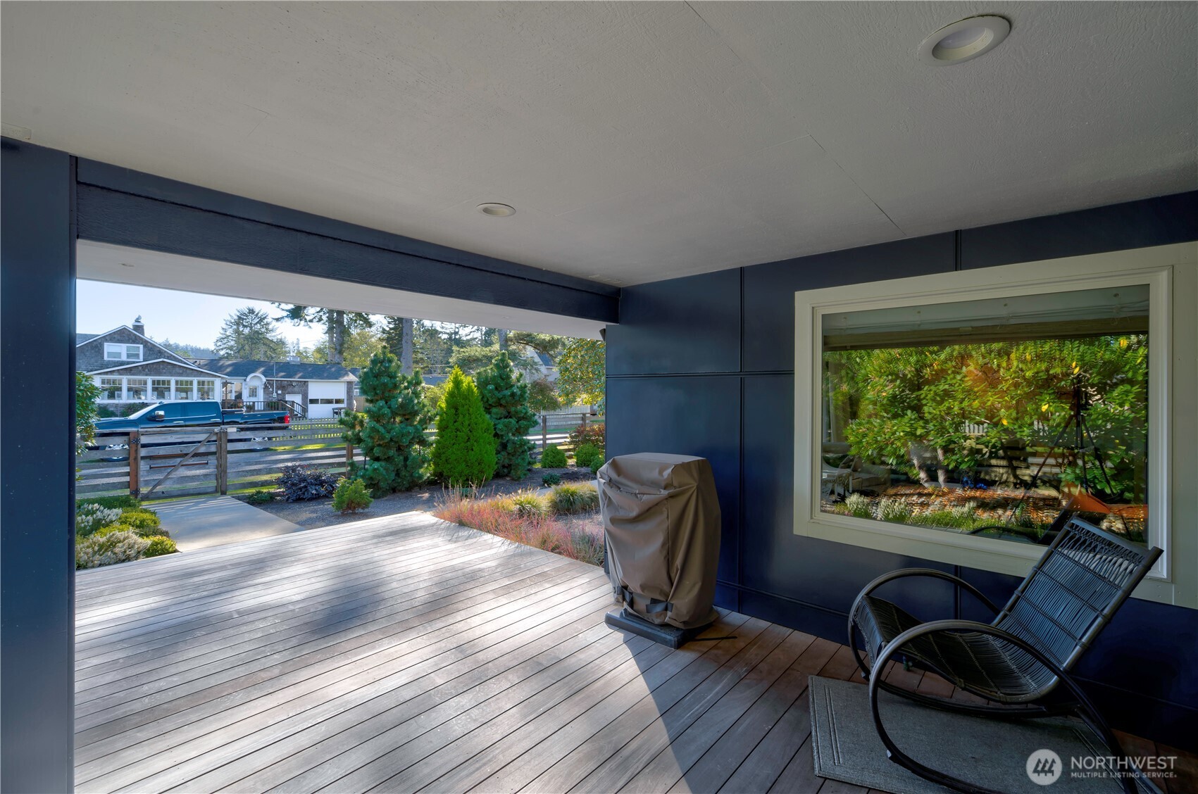 1115 34 Street Seaview, WA 98644 - Photo 3 of 31 a living room with furniture and a floor to ceiling window