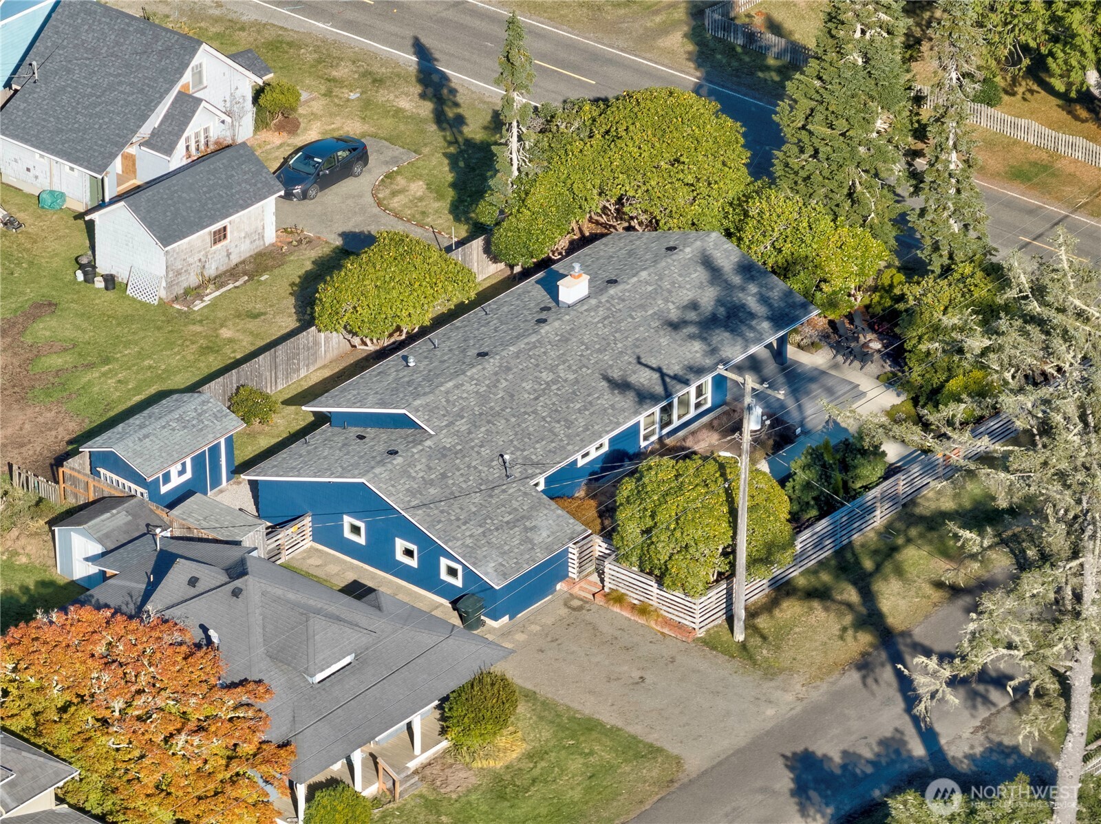 1115 34 Street Seaview, WA 98644 - Photo 31 of 31 an aerial view of a house with a yard and swimming pool
