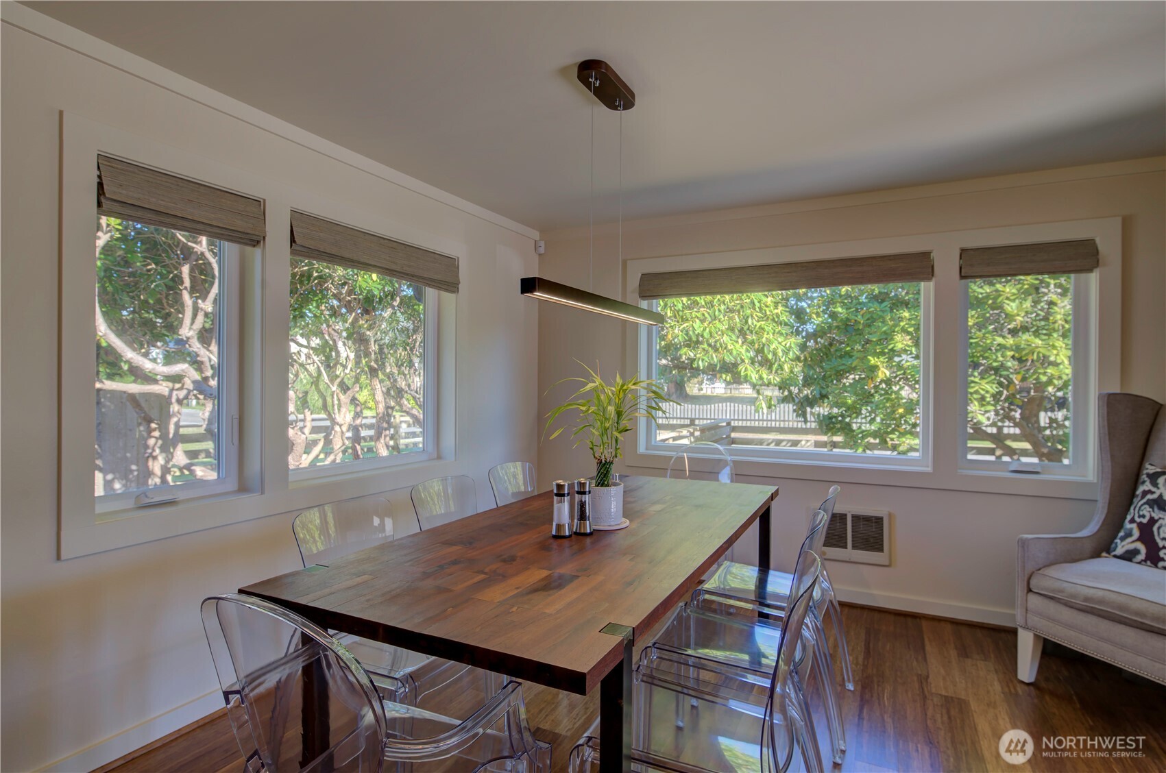 1115 34 Street Seaview, WA 98644 - Photo 8 of 31 a dining room with furniture and wooden floor