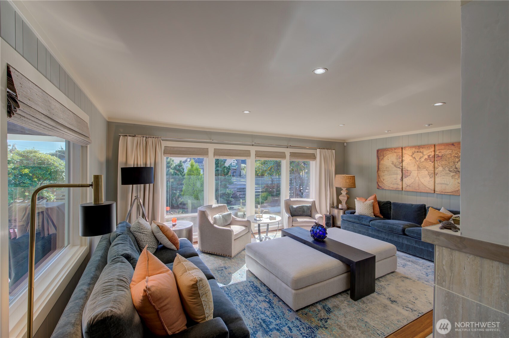 1115 34 Street Seaview, WA 98644 - Photo 10 of 31 a living room with furniture large windows and a flat screen tv