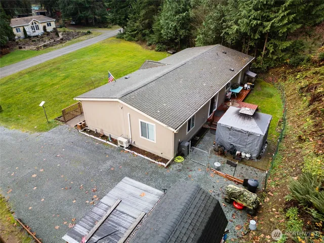 an aerial view of a houses with yard