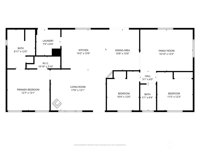 a living room with furniture and flowers