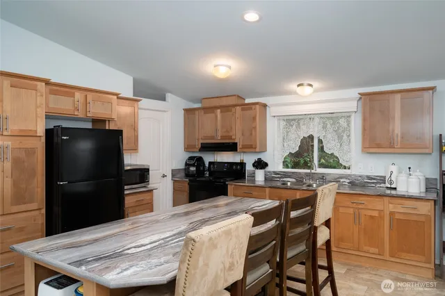 a view of kitchen with breakfast area
