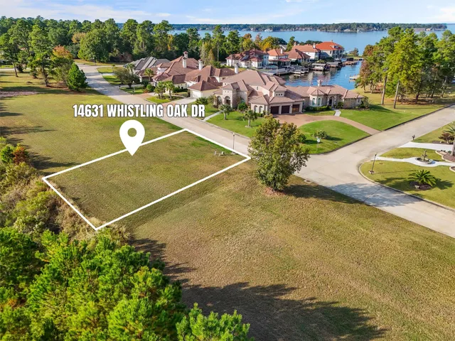 a view of a swimming pool with seating area and furniture