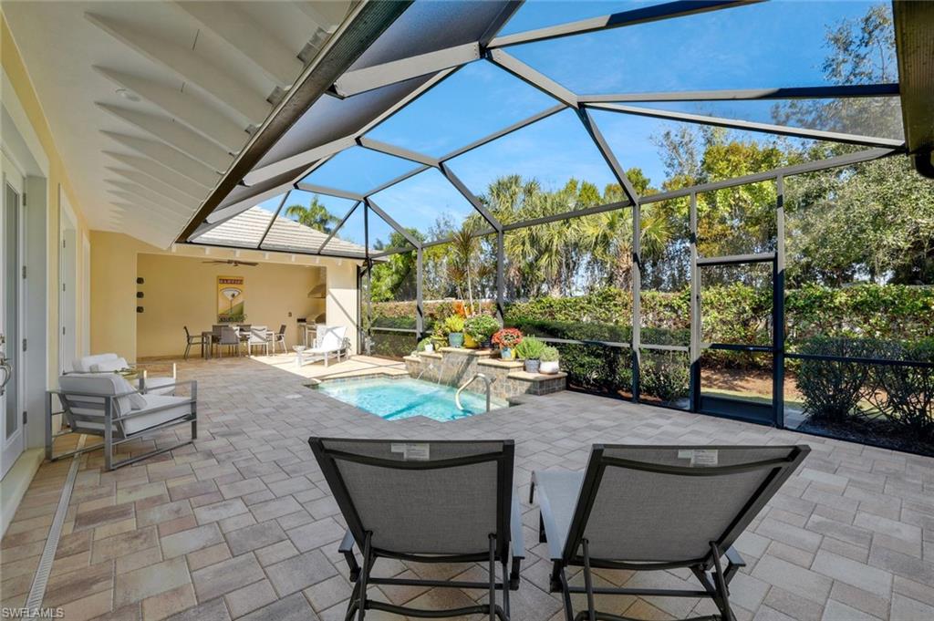 5167 Andros Drive Naples, FL 34113 - Photo 27 of 32 a view of an outdoor dining space with a patio