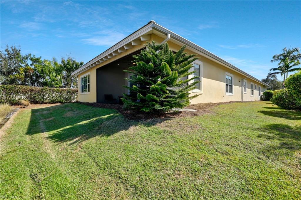 5167 Andros Drive Naples, FL 34113 - Photo 32 of 32 a view of a house with a yard