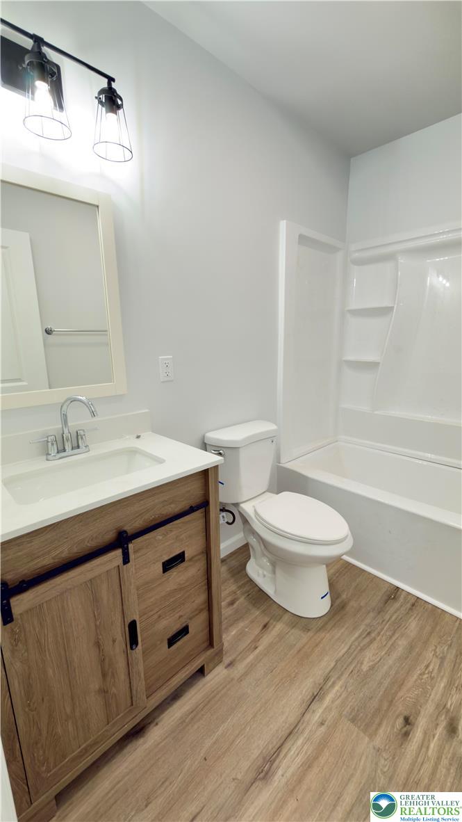 403 North Walnut Street, Unit B Bath, PA 18014 - Photo 22 of 31 a bathroom with a sink a toilet and shower