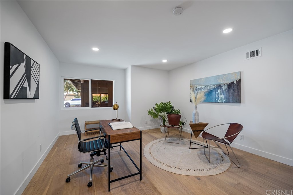 13151 Morrison Street Sherman Oaks, CA 91423 - Photo 11 of 26 a workspace with furniture and painting on the wall
