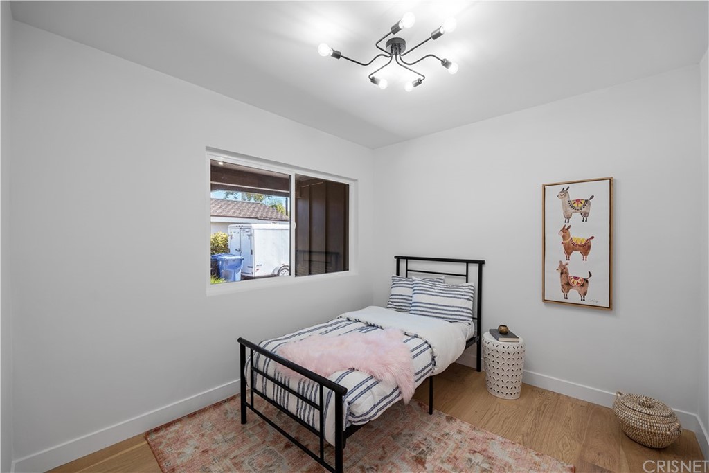 13151 Morrison Street Sherman Oaks, CA 91423 - Photo 13 of 26 a bedroom with a bed and a window