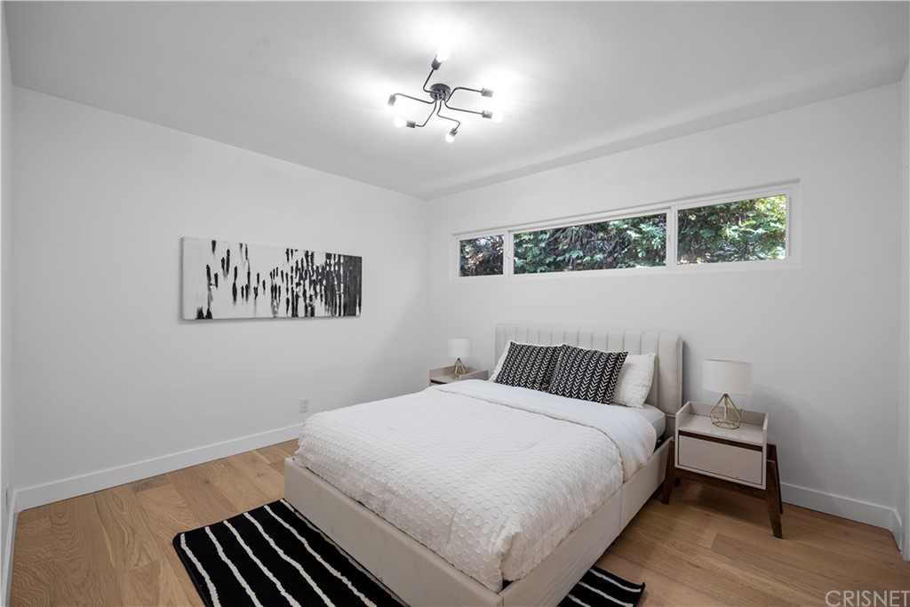 13151 Morrison Street Sherman Oaks, CA 91423 - Photo 17 of 26 a bedroom with a bed and a painting on the wall