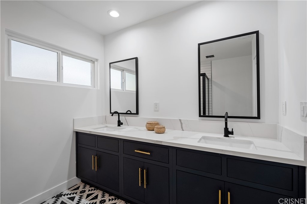 13151 Morrison Street Sherman Oaks, CA 91423 - Photo 19 of 26 a bathroom with a sink and a mirror