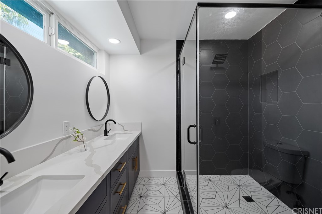 13151 Morrison Street Sherman Oaks, CA 91423 - Photo 22 of 26 a bathroom with a double vanity sink and a mirror