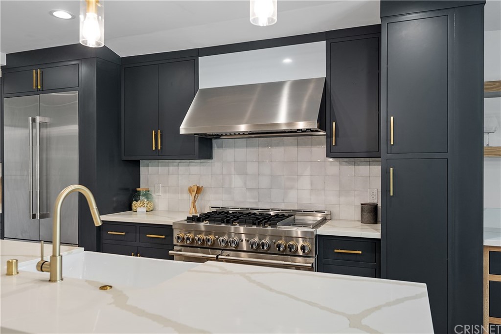 13151 Morrison Street Sherman Oaks, CA 91423 - Photo 5 of 26 a kitchen with a stove and a sink