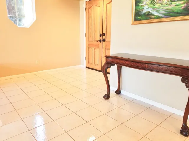 a view of staircase with white walls and a window