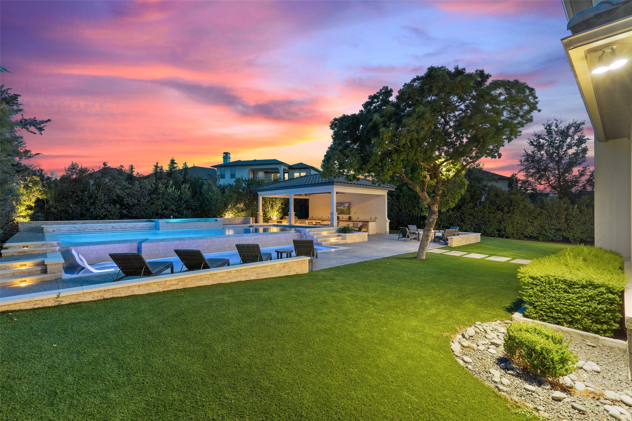 a view of a house with backyard porch and sitting area