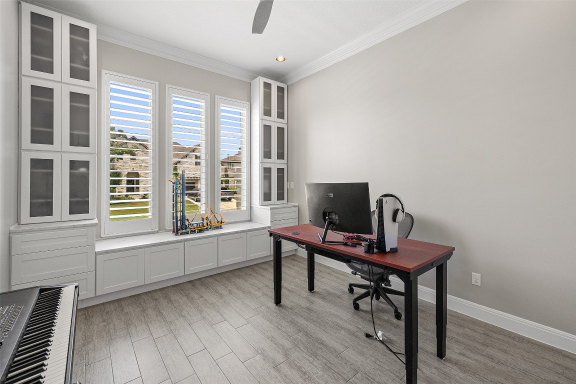 403 Woodside Terrace Austin, TX 78738 - Photo 12 of 38 a work room with furniture and windows