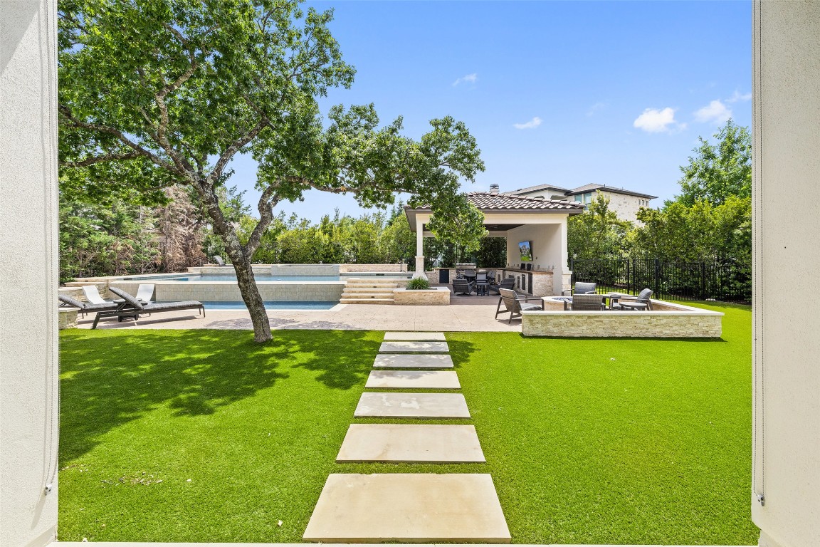 403 Woodside Terrace Austin, TX 78738 - Photo 14 of 38 a swimming pool with outdoor seating and garden