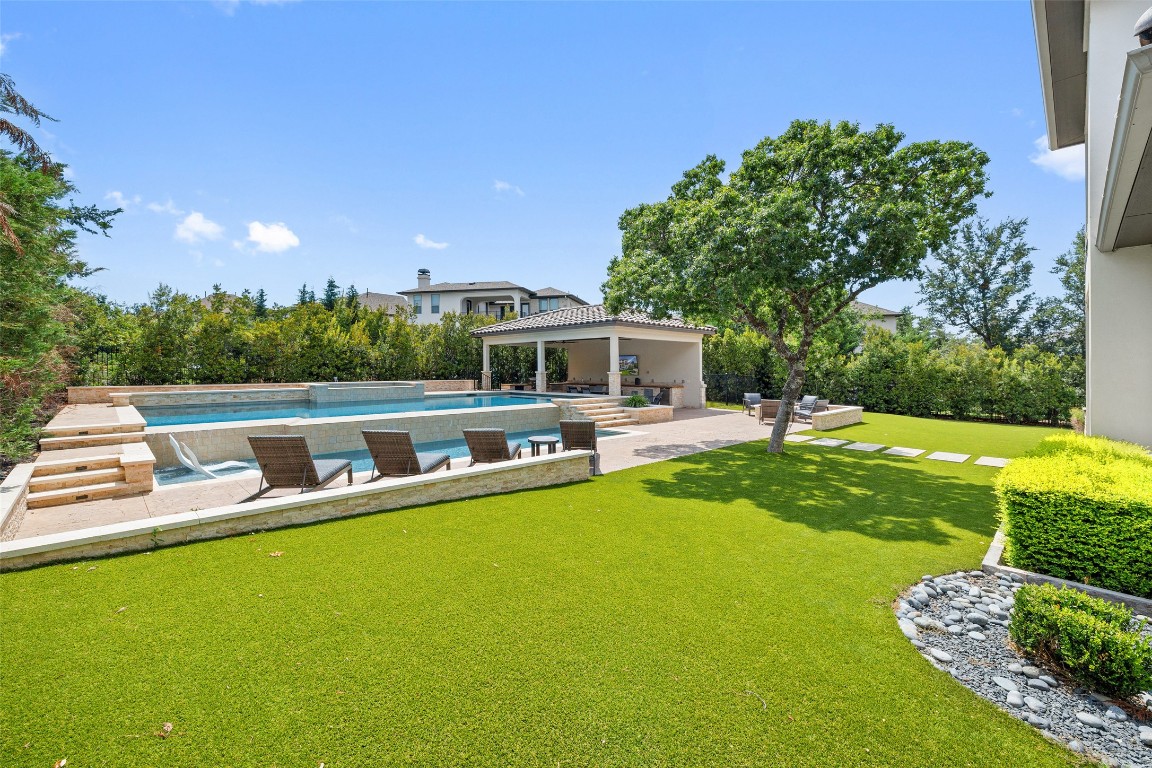 403 Woodside Terrace Austin, TX 78738 - Photo 15 of 38 a view of a house with a big yard