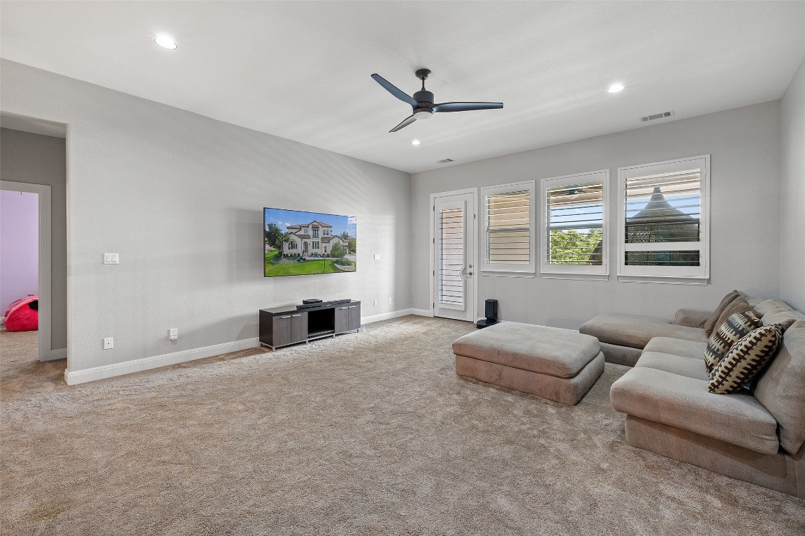 403 Woodside Terrace Austin, TX 78738 - Photo 20 of 38 a living room with furniture and windows