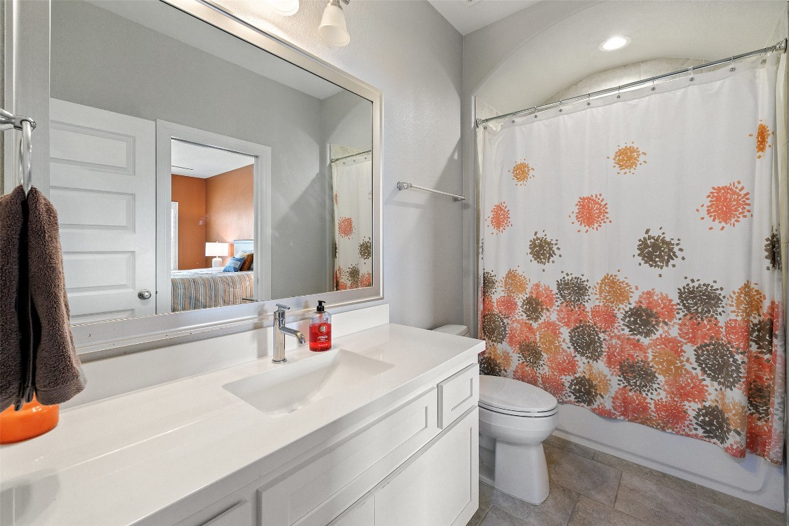 403 Woodside Terrace Austin, TX 78738 - Photo 22 of 38 a bathroom with a sink toilet and shower