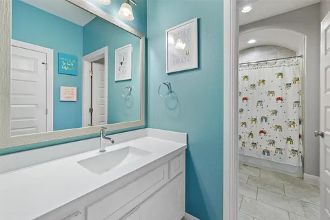 a view of a patio with couches and table and chairs with wooden fence