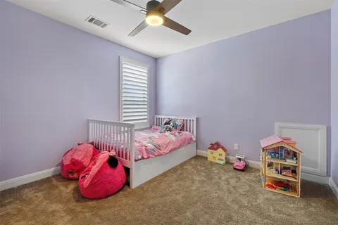 a view of a house with swimming pool and sitting area