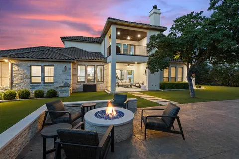 an aerial view of a house with yard swimming pool and outdoor seating