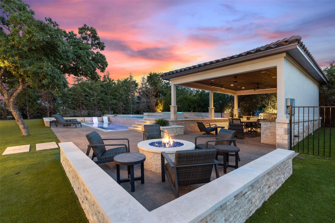 403 Woodside Terrace Austin, TX 78738 - Photo 30 of 38 a view of a patio with couches and table and chairs with wooden fence