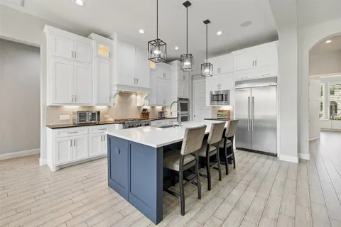 a work room with furniture and windows