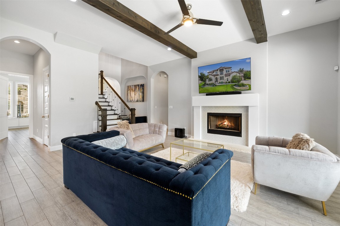 403 Woodside Terrace Austin, TX 78738 - Photo 10 of 38 a living room with furniture and a fireplace
