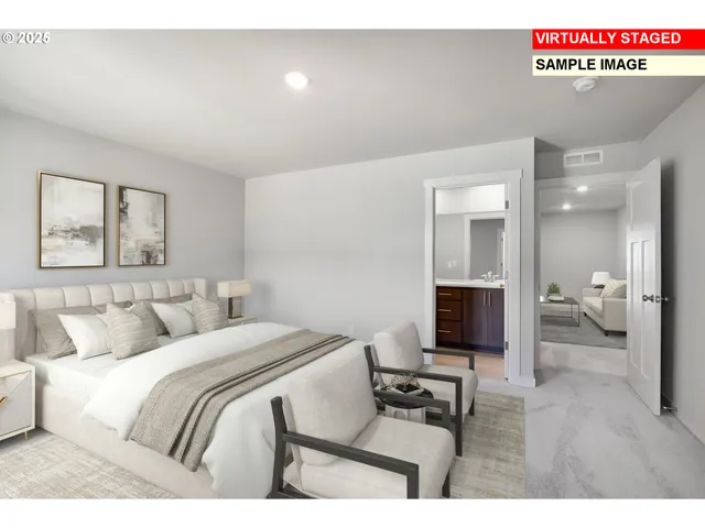 a bedroom with a bed and a view of living room