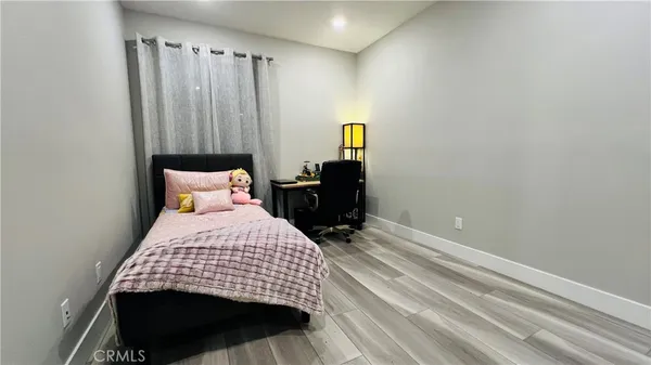 a view of a livingroom with furniture and a flat screen tv