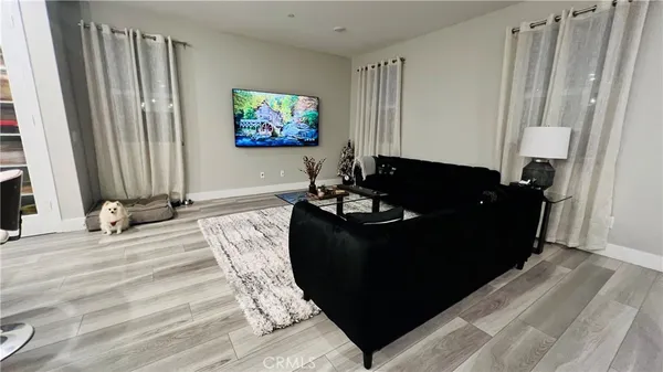 a kitchen with stainless steel appliances a sink a stove a refrigerator and cabinets