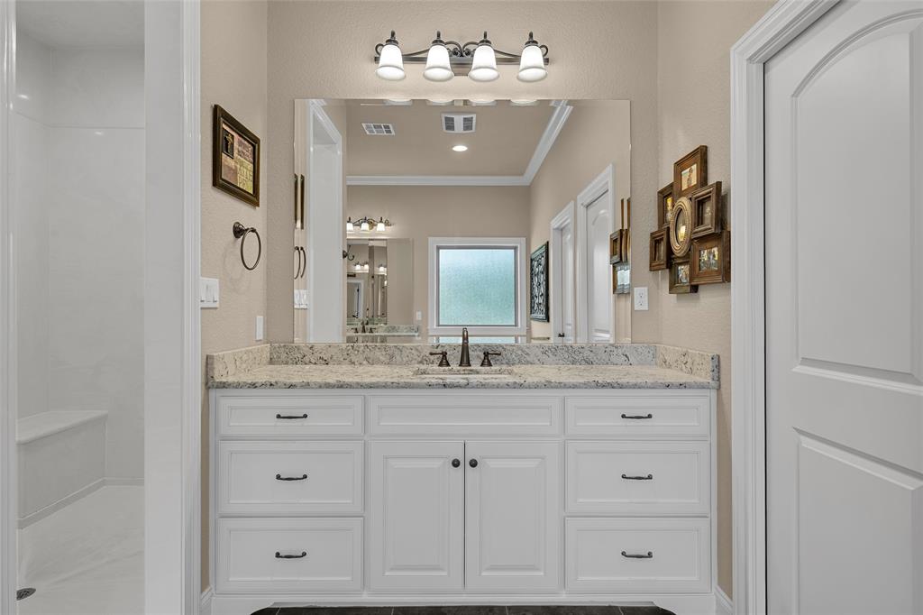 14690 Chapel Road Lorena, TX 76655 - Photo 13 of 40 a bathroom with a granite countertop sink vanity and mirror