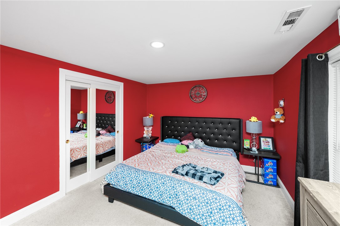 358 Finley Road Easley, SC 29642 - Photo 14 of 20 This cozy bedroom features a mirrored closet and plush carpeting, creating a comfortable retreat.