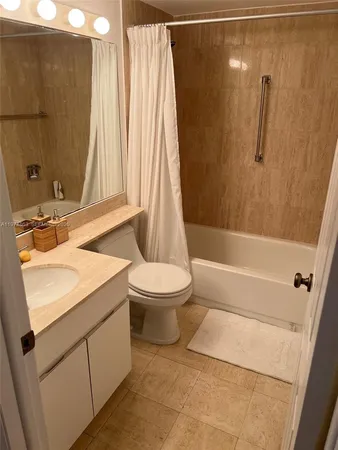 a bathroom with a sink a toilet and a bathtub