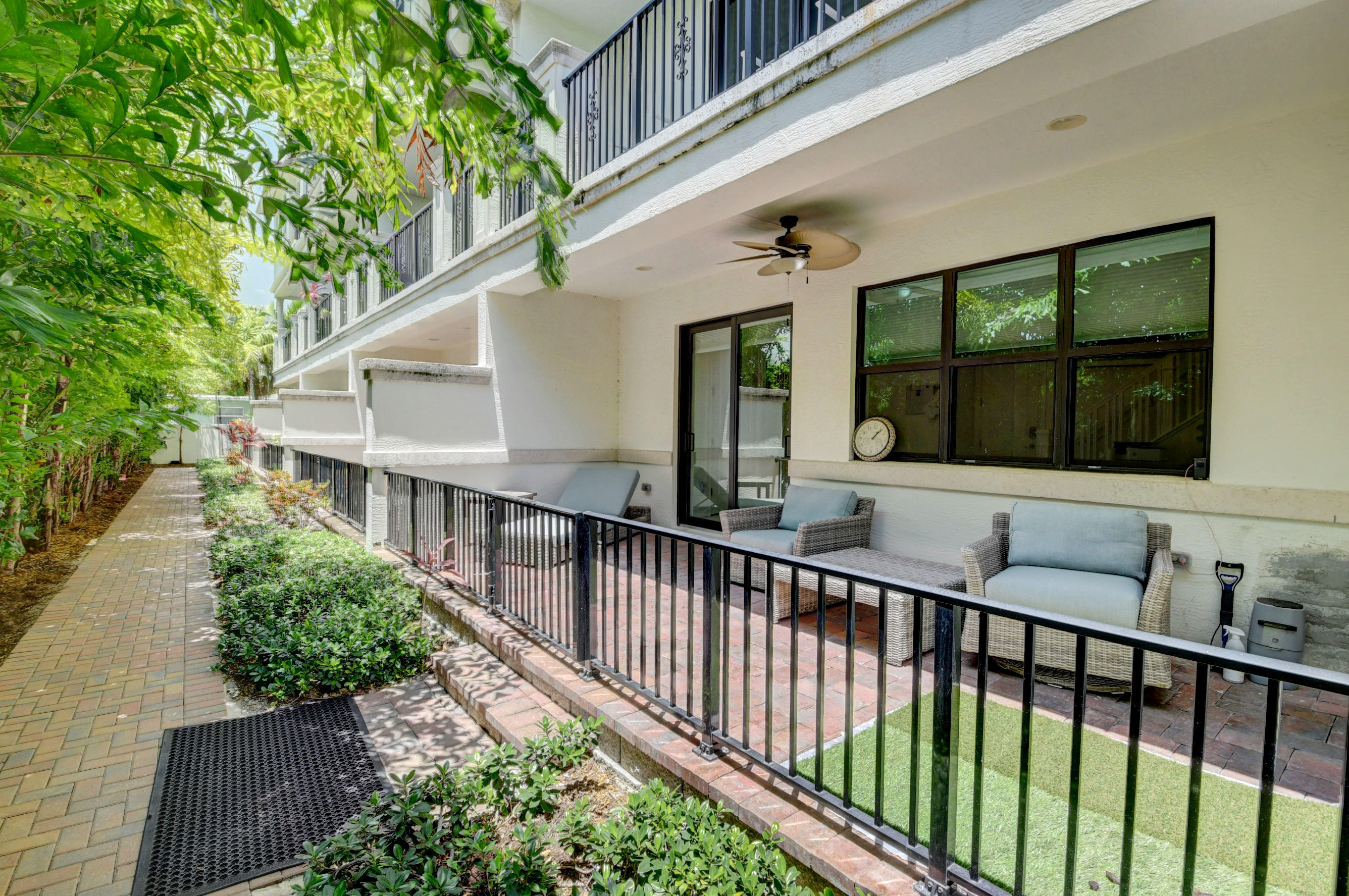 608 Windward Circle Boynton Beach, FL 33435 - Photo 31 of 42 a view of a house with large windows and stairs