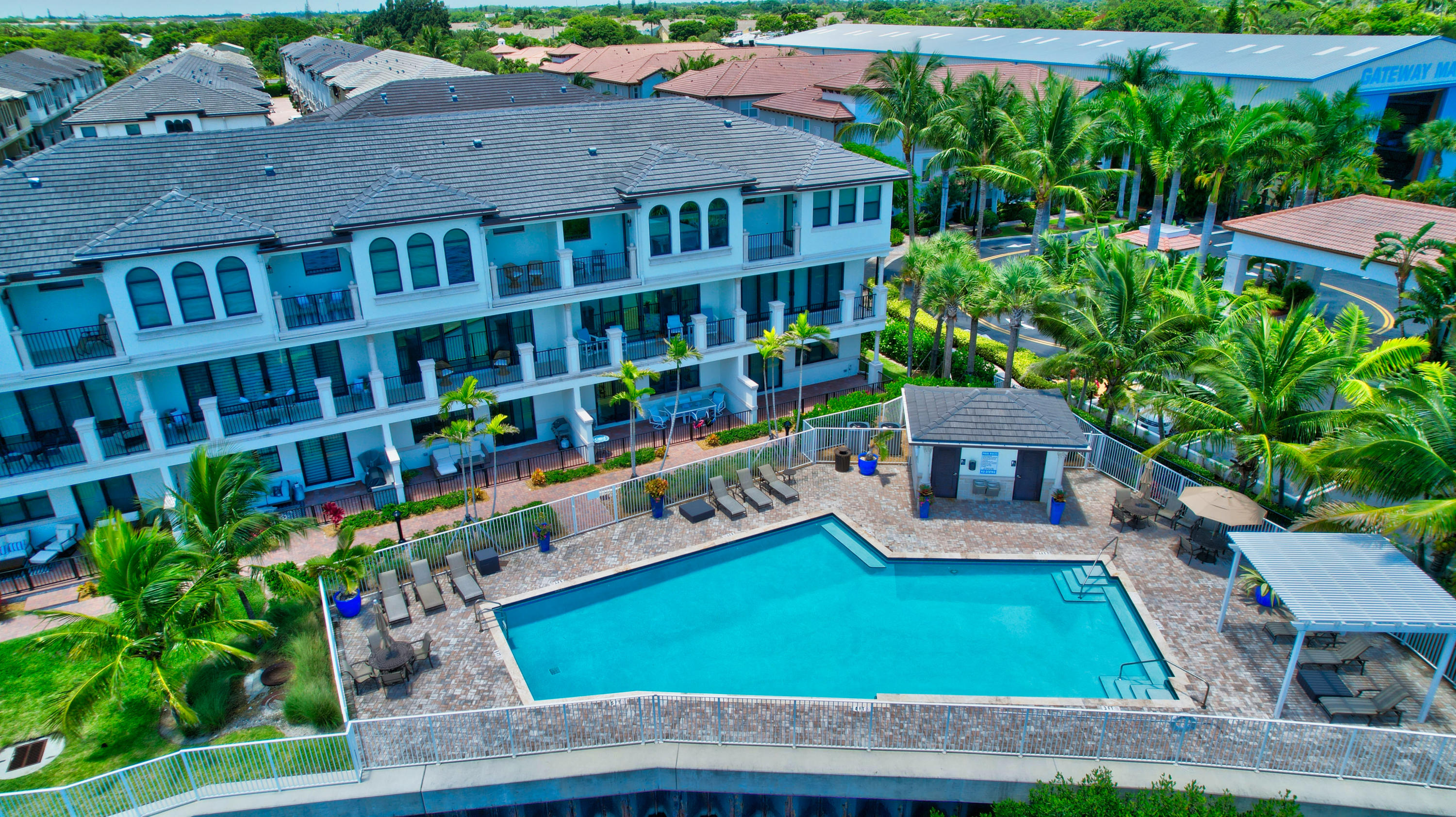 608 Windward Circle Boynton Beach, FL 33435 - Photo 41 of 42 a wooden bench sitting in front of a building