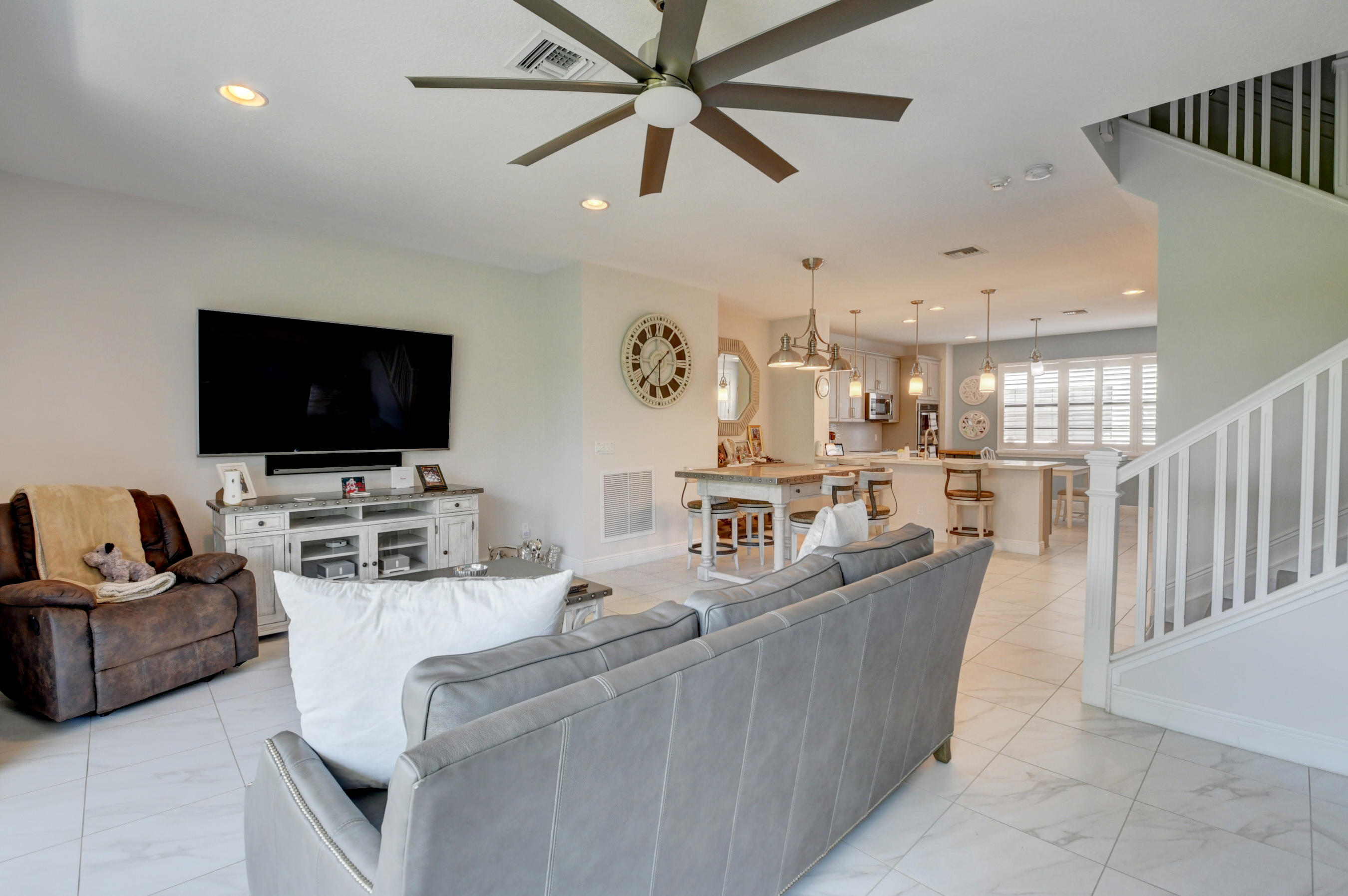 608 Windward Circle Boynton Beach, FL 33435 - Photo 10 of 42 a living room with furniture and a flat screen tv