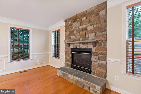 a large kitchen with stainless steel appliances granite countertop a stove a sink and a microwave