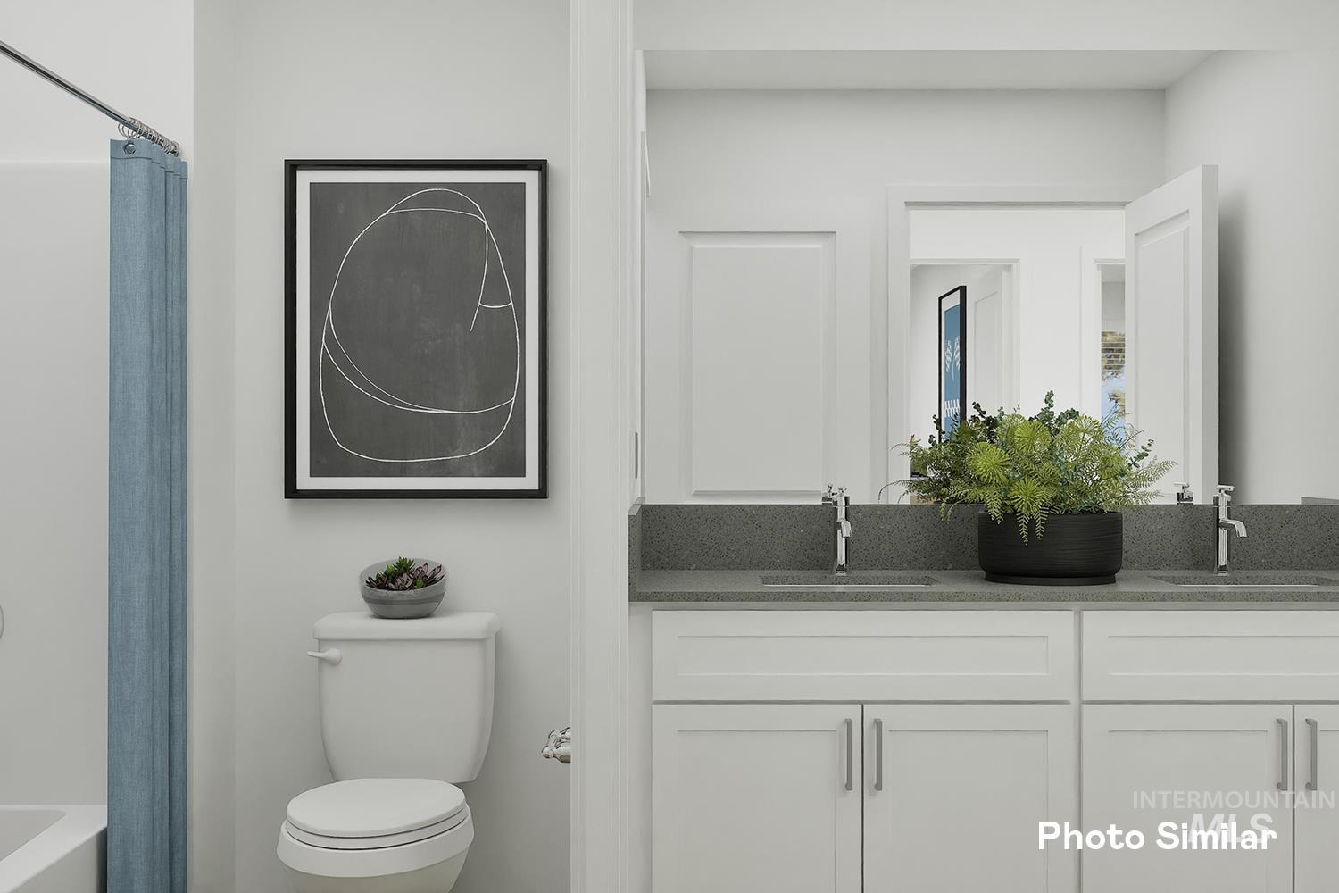 213 Ravello Street Caldwell, ID 83605 - Photo 10 of 25 Bathroom featuring double vanity and toilet
