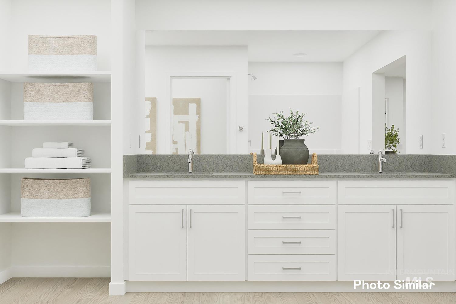 213 Ravello Street Caldwell, ID 83605 - Photo 23 of 25 Bathroom with double vanity and wood finished floors