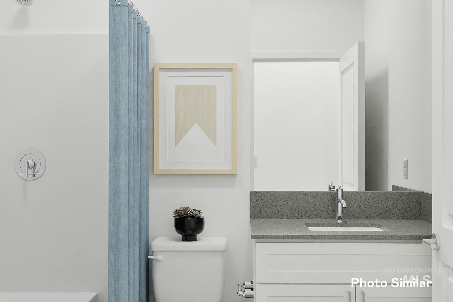 213 Ravello Street Caldwell, ID 83605 - Photo 9 of 25 Bathroom with vanity and toilet