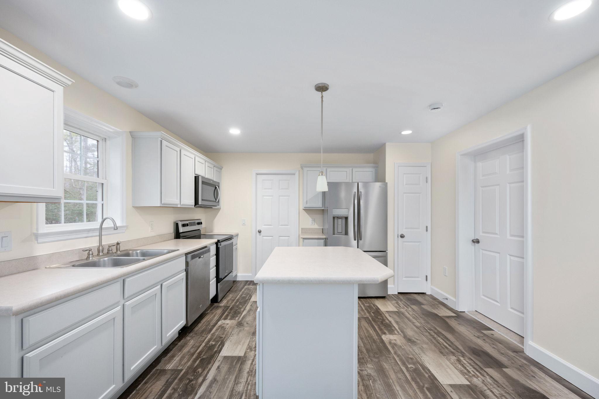 300 River Oaks Road Center Cross, VA 22437 - Photo 16 of 39 Modern kitchen with sleek finishes.