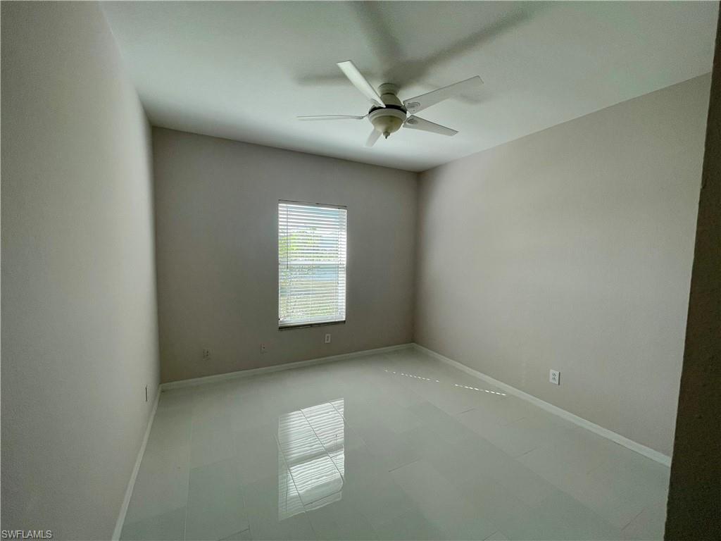 2895 Orange Grove Trail Naples, FL 34120 - Photo 12 of 33 an empty room with a window